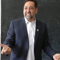 Dr. Muhammad Shakil Ahmad Blackboard Suit Portrait